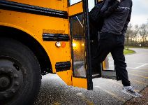  Boy stepping off school bus